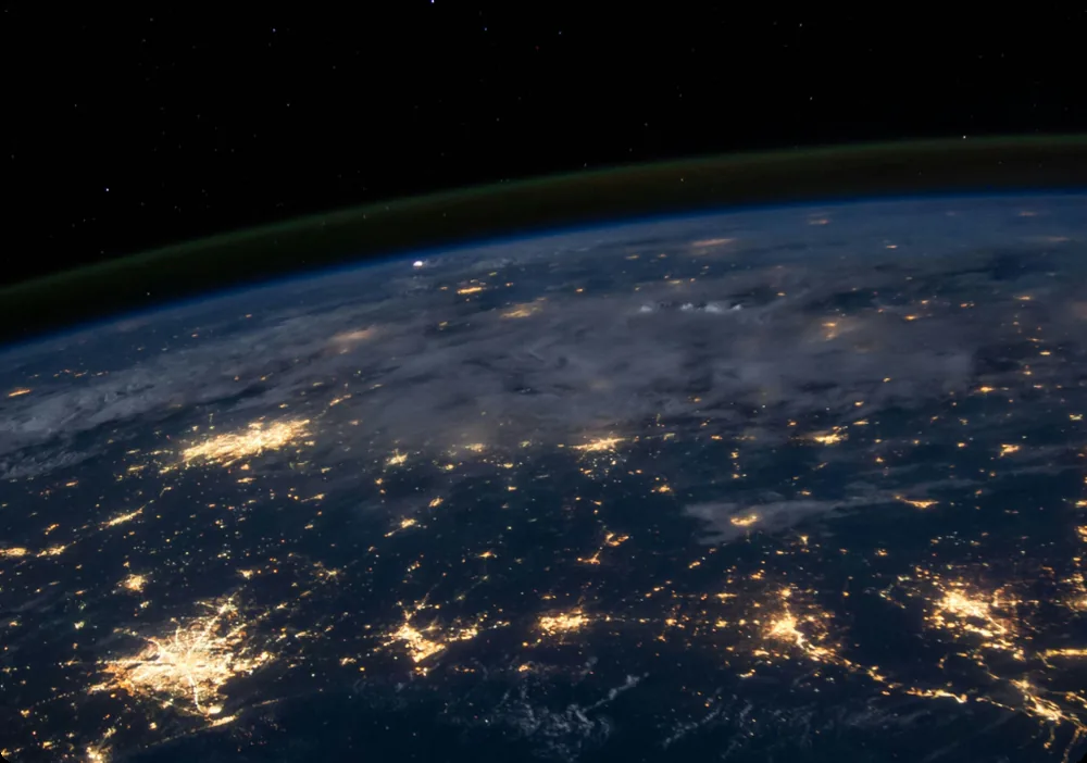 Earth from space at night — global compute infrastructure